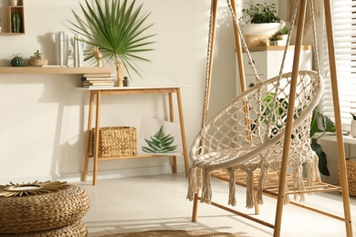 Comfortable hammock chair in stylish room. Interior design