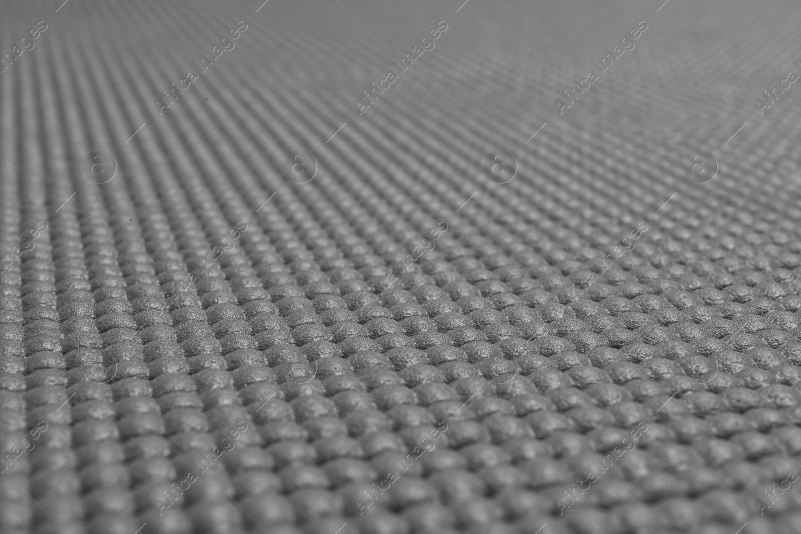 Photo of Grey sports mat texture as background, closeup