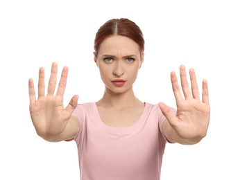 Photo of Woman showing stop gesture on white background