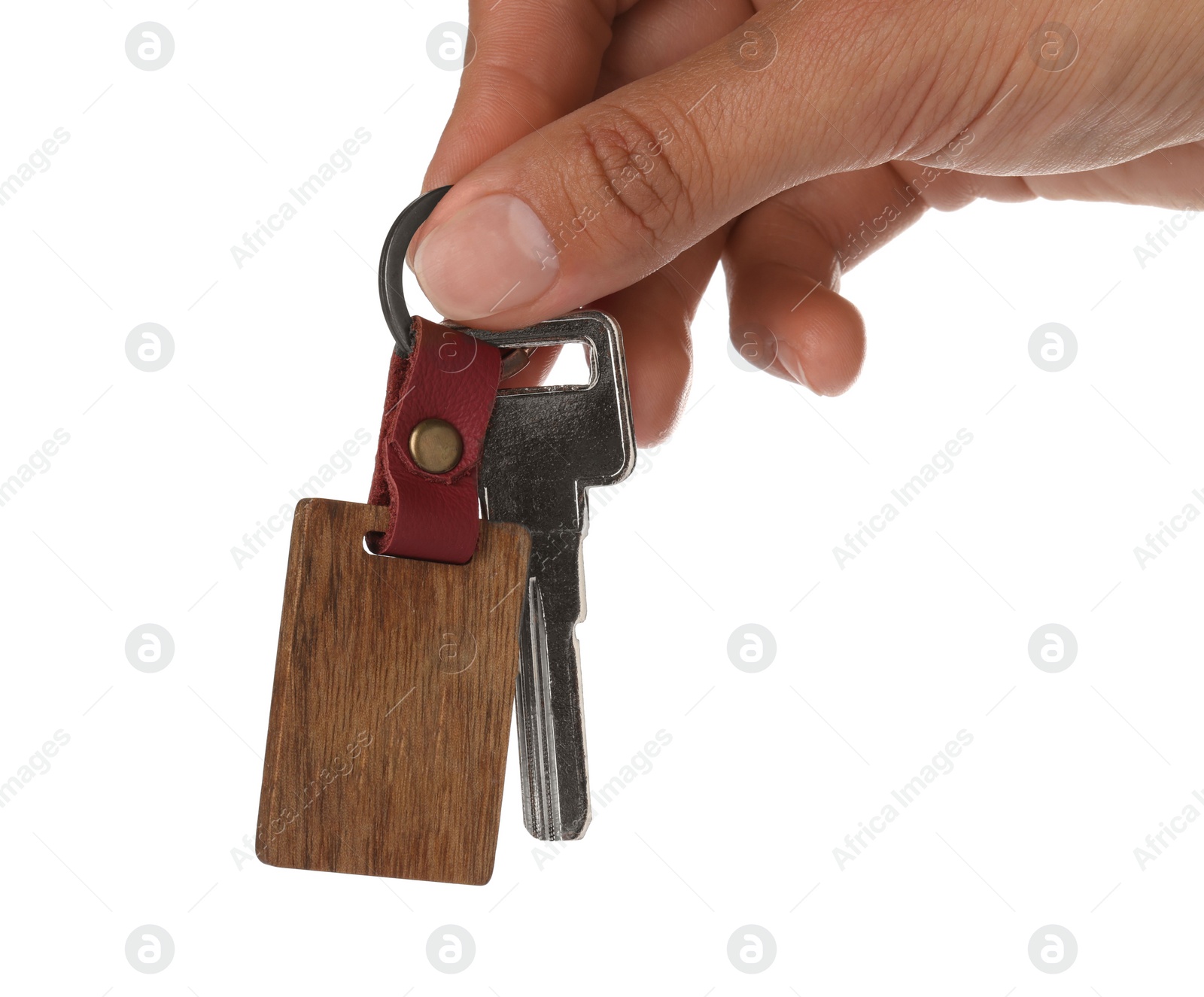 Photo of Woman holding key with wooden keychain on white background, closeup