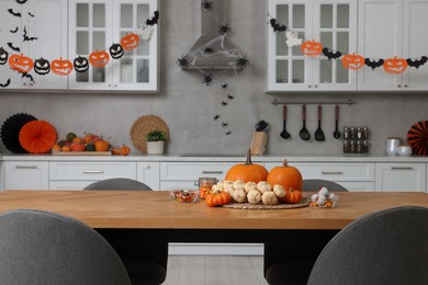 Photo of Stylish kitchen interior with festive decor. Halloween celebration