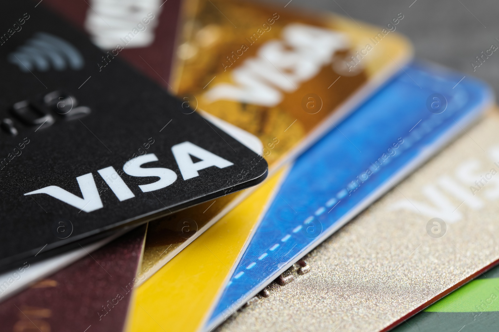 Photo of MYKOLAIV, UKRAINE - FEBRUARY 22, 2022: Pile of Visa credit cards, closeup