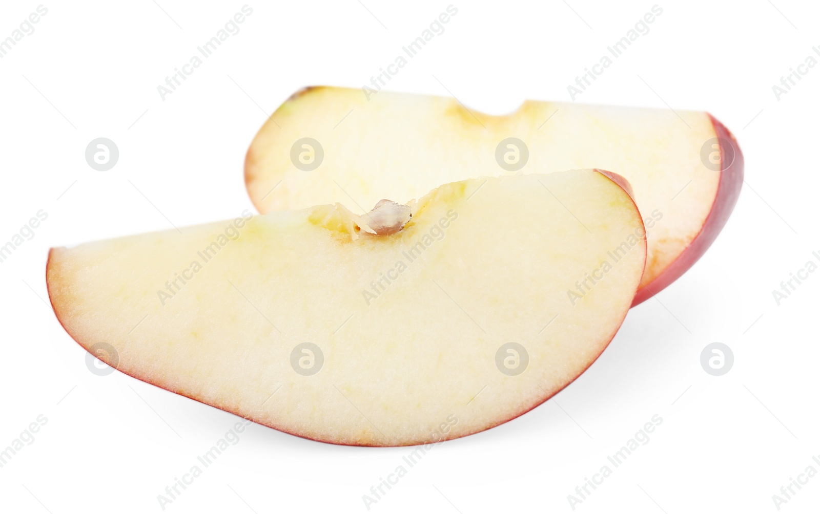 Photo of Slices of ripe red apple isolated on white