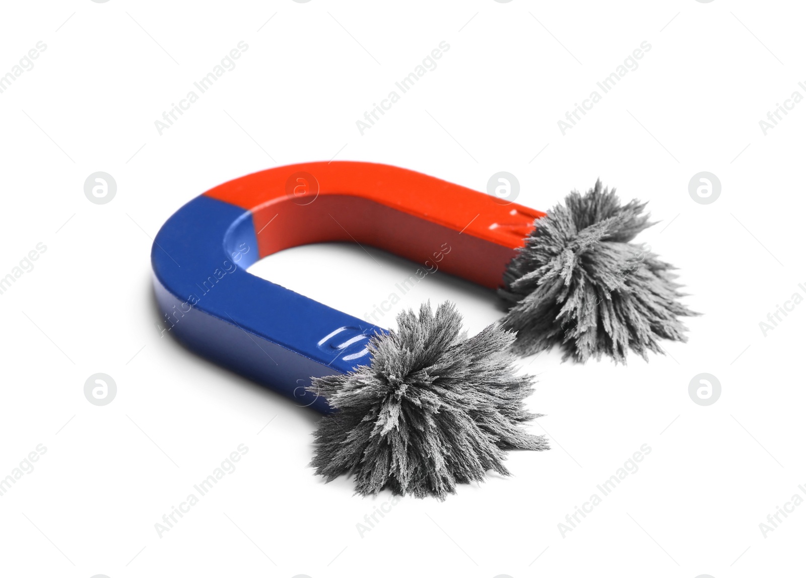 Photo of Red and blue horseshoe magnet with iron filings on white background