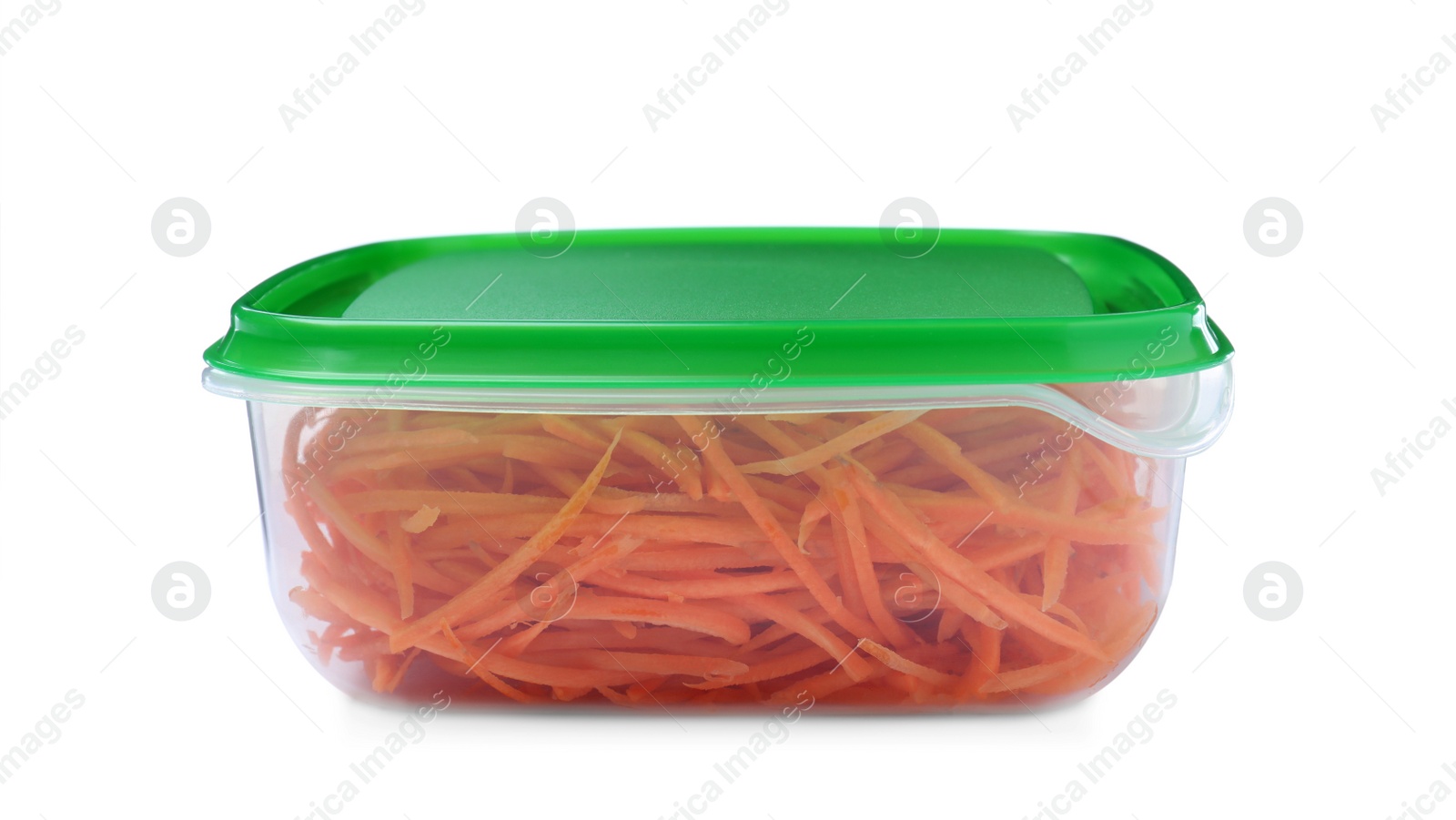 Photo of Fresh shredded carrots in plastic container isolated on white