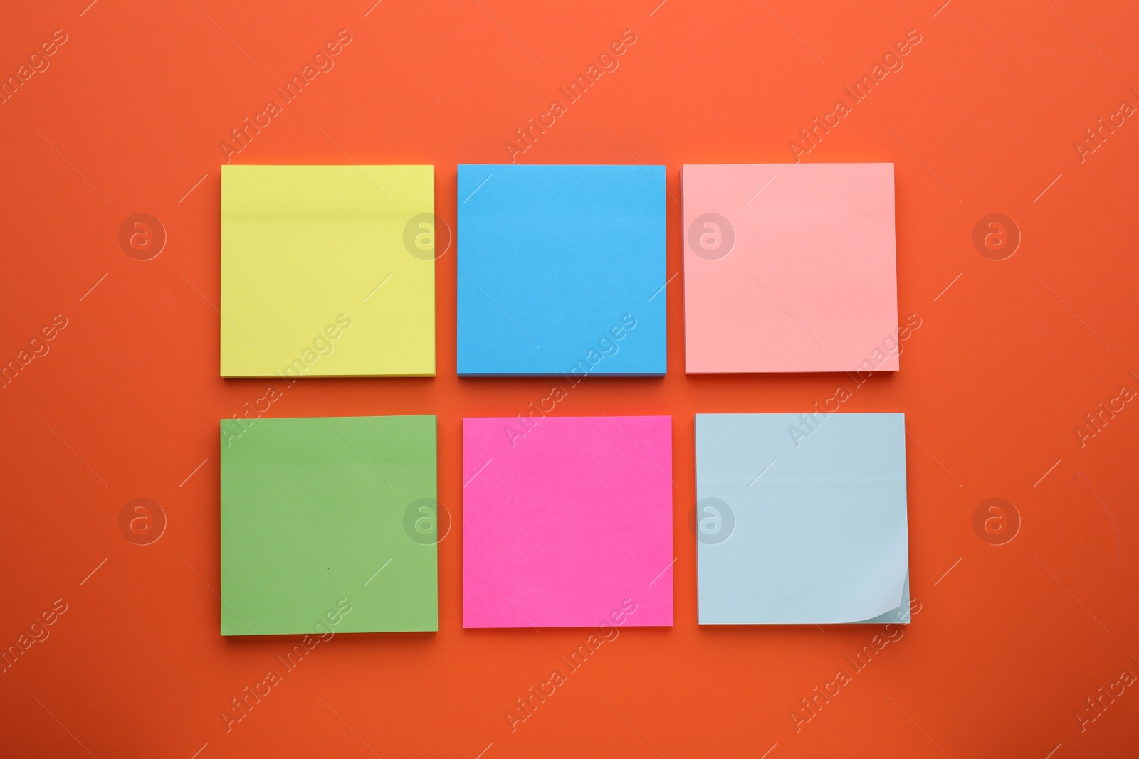 Photo of Paper notes on orange background, flat lay