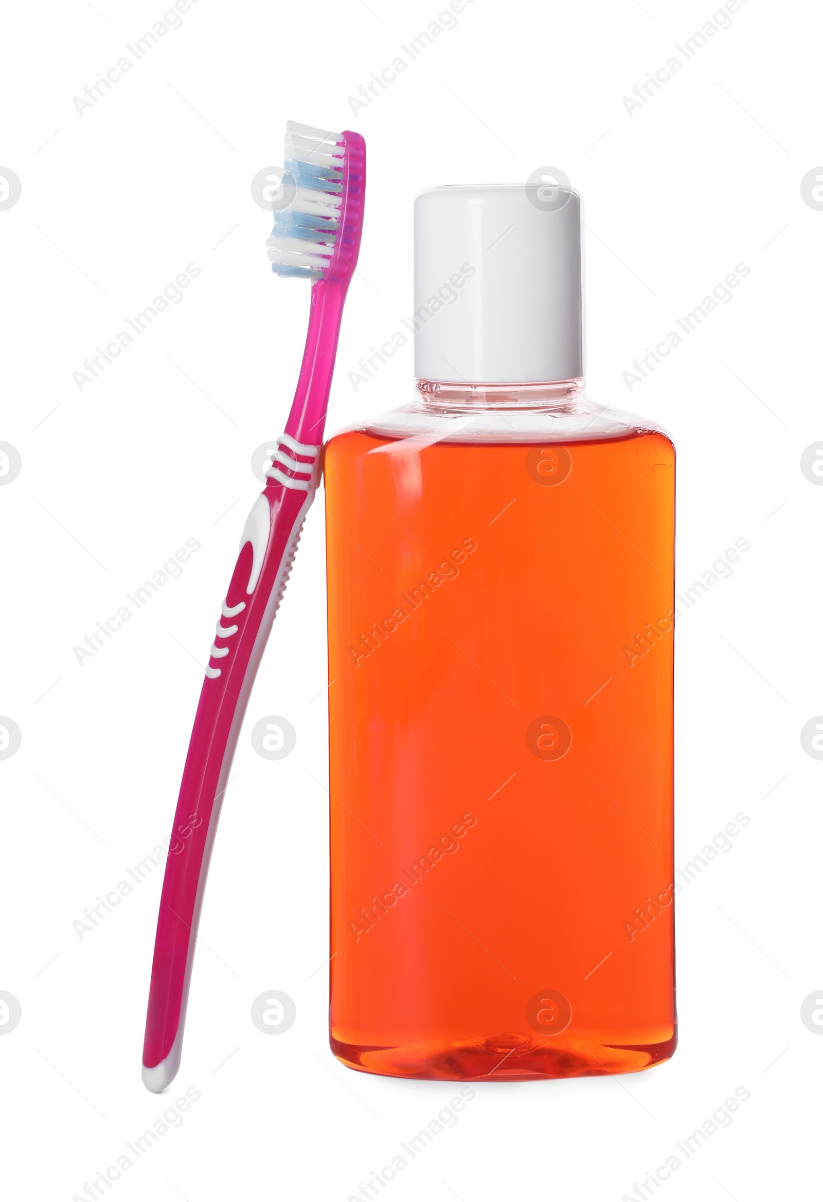 Photo of Bottle of mouthwash and toothbrush isolated on white