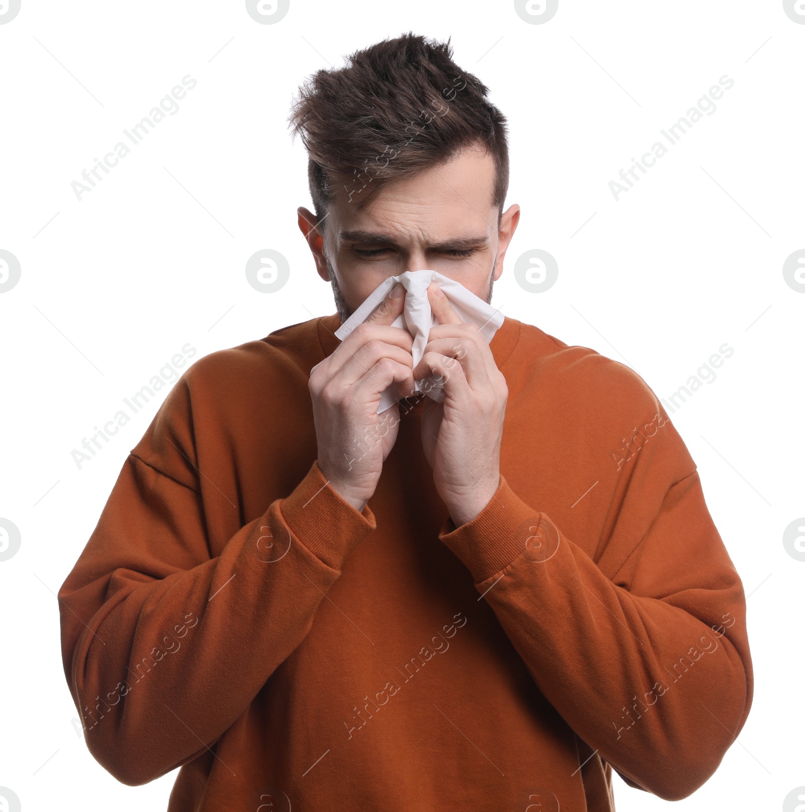 Photo of Sick man sneezing on white background. Cold symptoms