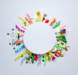 Photo of Frame of festive items on white background, flat lay with space for text. Surprise party concept