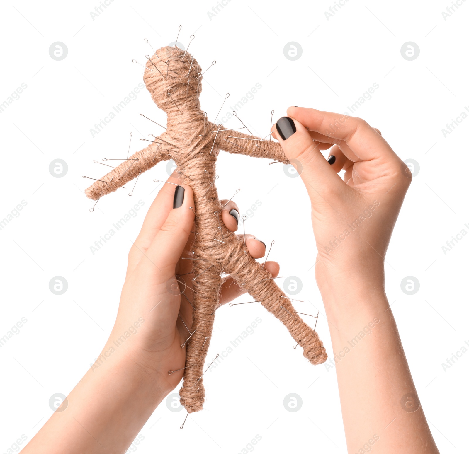 Photo of Woman stabbing voodoo doll with pin on white background, closeup