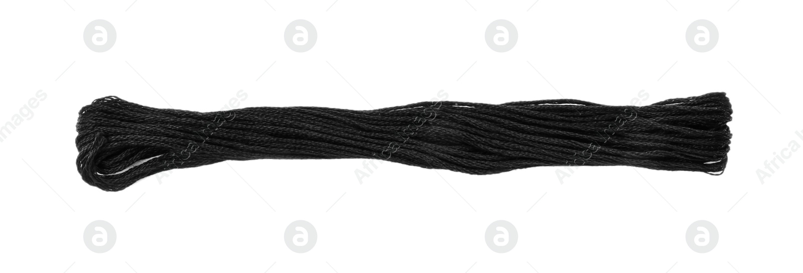 Photo of Bright black embroidery thread on white background