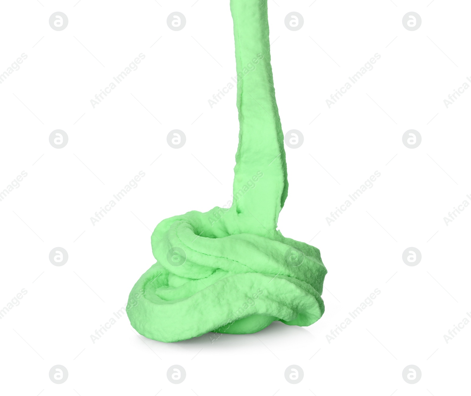 Photo of Flowing green slime on white background. Antistress toy