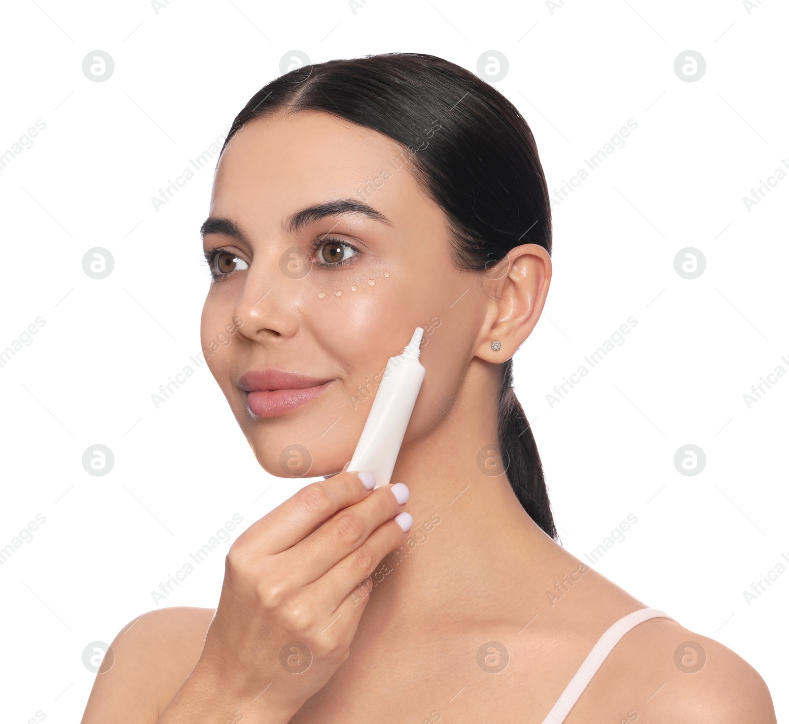 Photo of Beautiful young woman with gel on skin under eye against white background