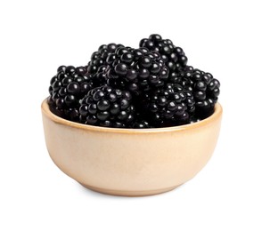 Photo of Bowl of ripe blackberries isolated on white