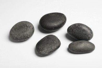 Group of different stones on white background