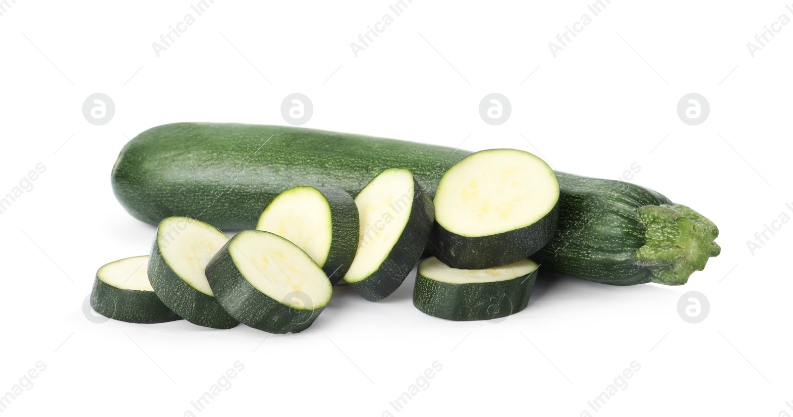 Photo of Cut and whole green ripe zucchini isolated on white