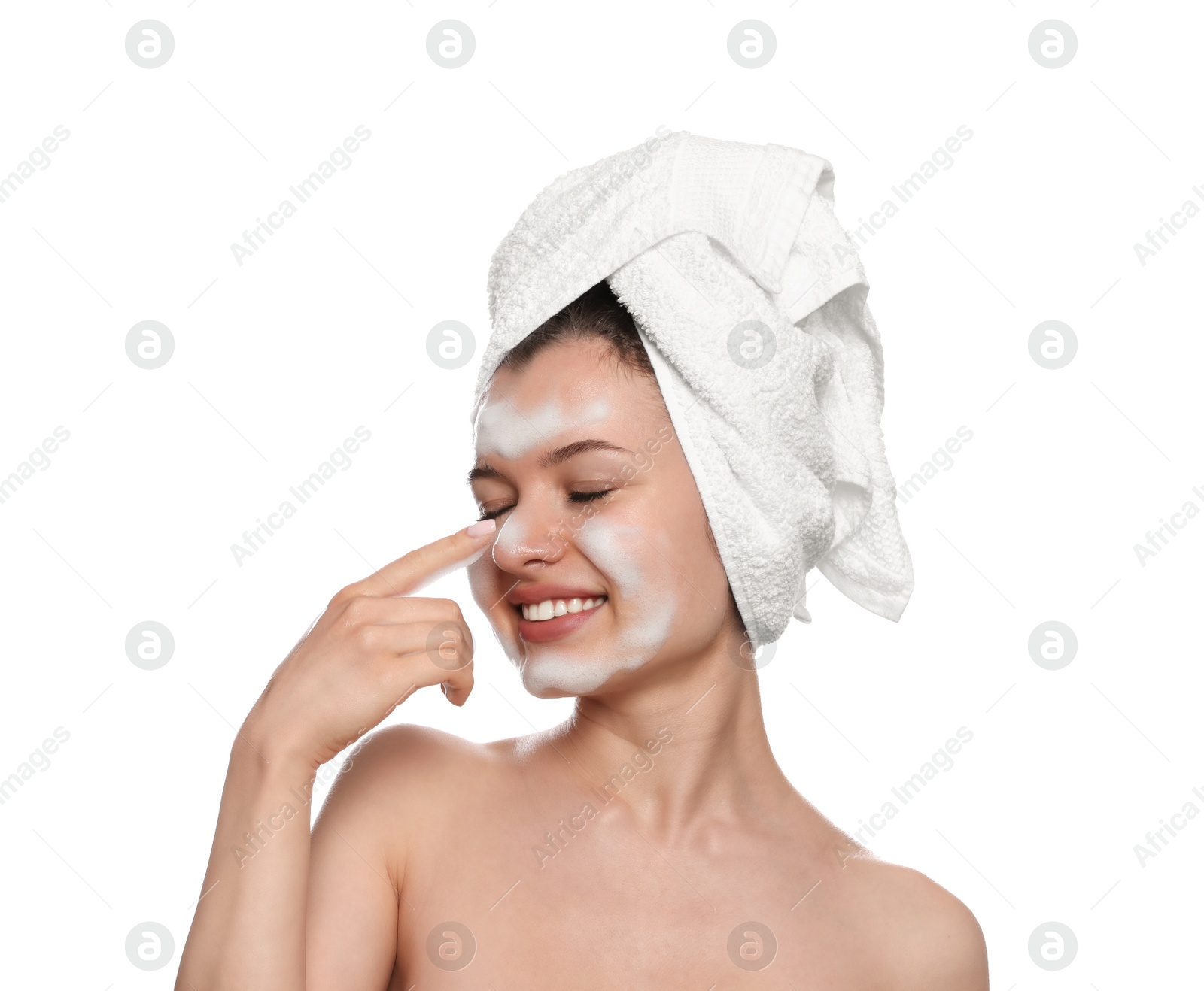 Photo of Young woman washing face with cleansing foam on white background. Skin care cosmetic