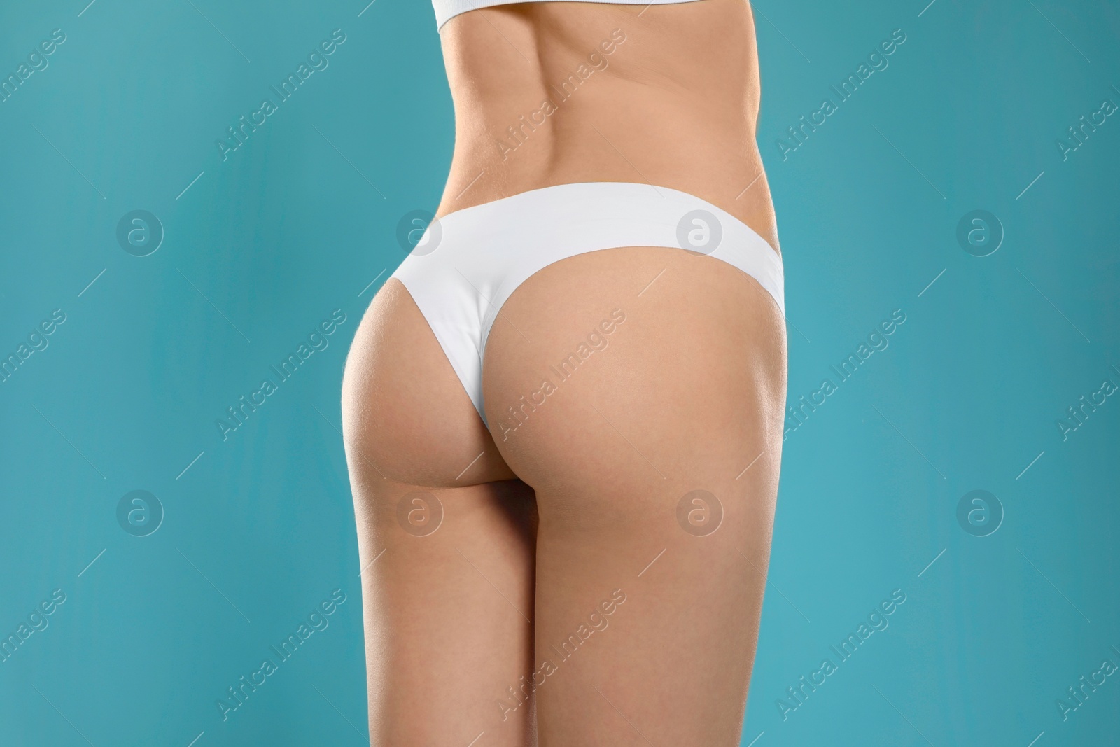 Photo of Slim young woman with smooth gentle skin on color background, closeup. Beauty and body care concept