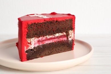 Photo of Cut bento cake on white wooden table, closeup. St. Valentine's day surprise