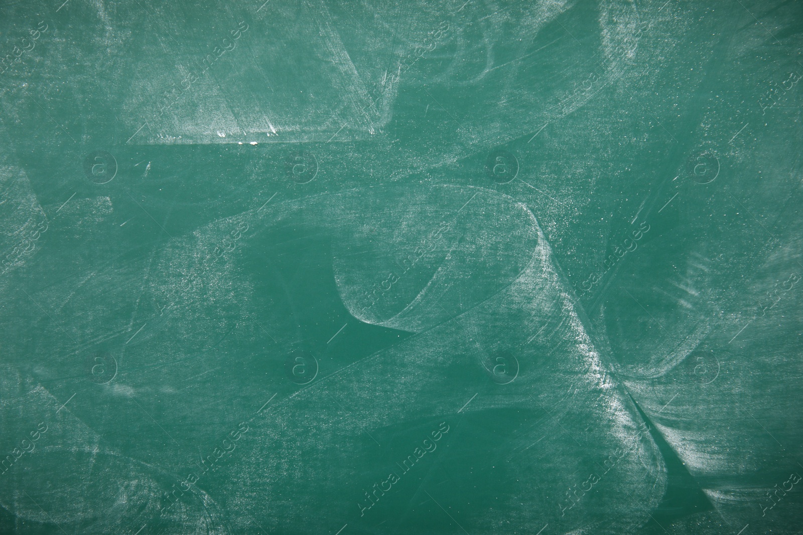 Photo of Dirty green chalkboard as background. Space for text