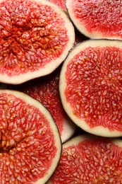 Pieces of fresh ripe figs as background, top view