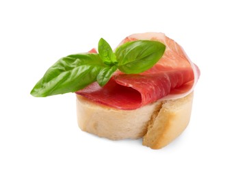 Photo of Tasty sandwich with cured ham and basil leaves isolated on white