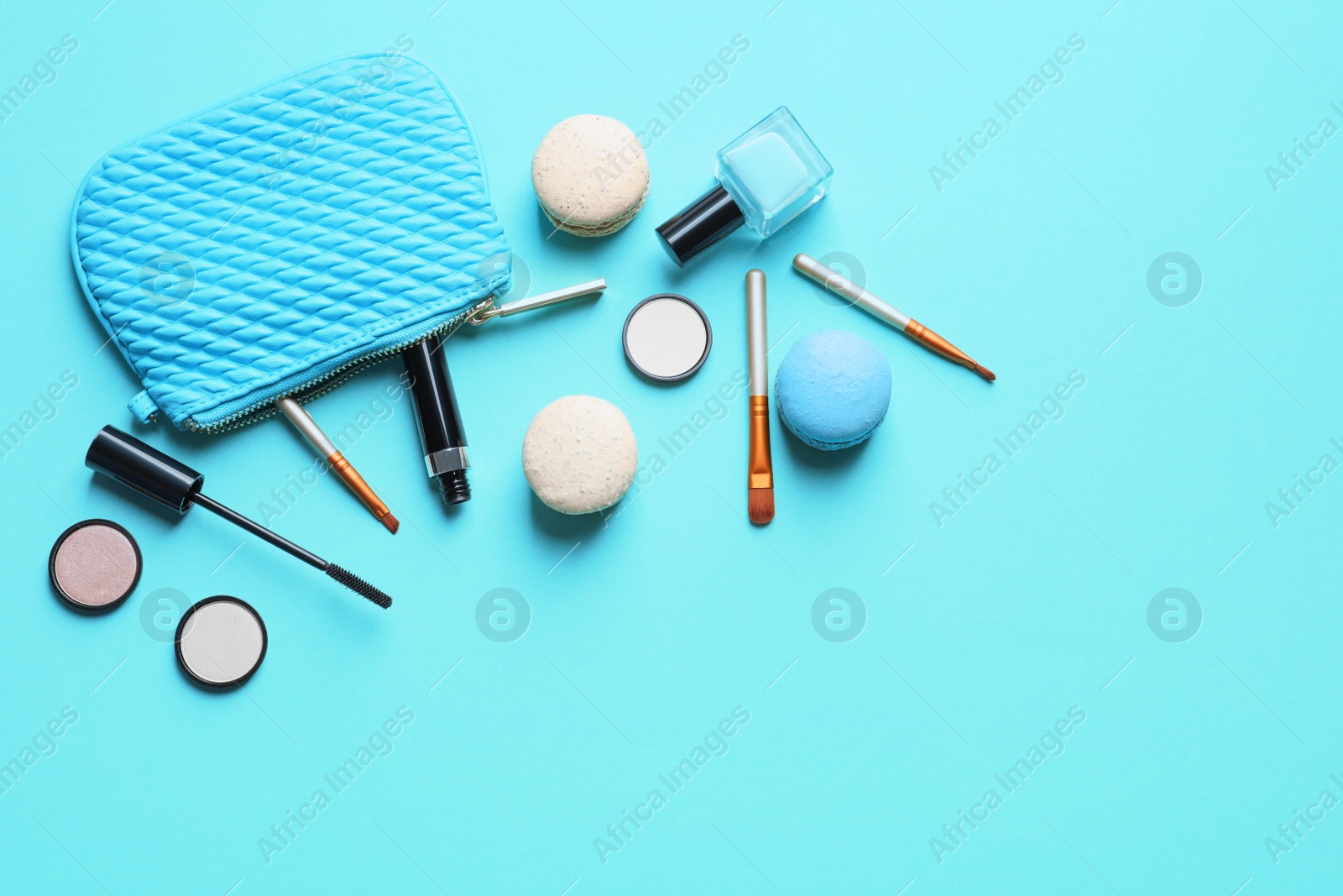 Photo of Makeup products with cosmetic bag on color background