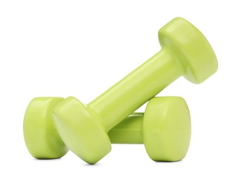 Light green dumbbells isolated on white. Sports equipment