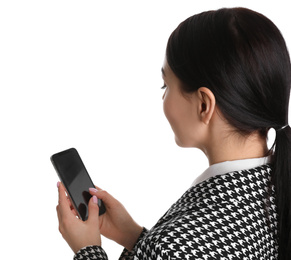 Young businesswoman with mobile phone on white background