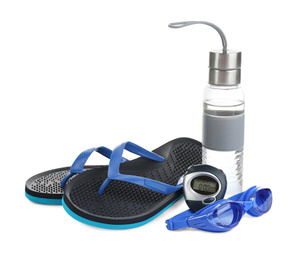 Photo of Swimming goggles, water bottle, flip flops and digital stopwatch isolated on white