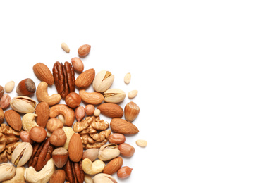 Different delicious nuts on white background, flat lay. Space for text