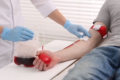 Photo of Patient undergoing blood transfusion in hospital, closeup