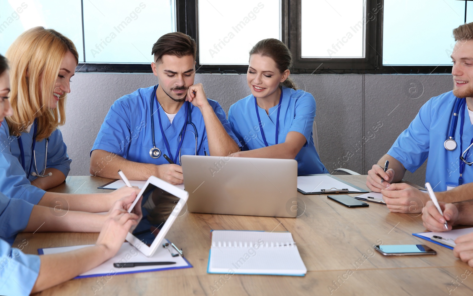 Photo of Medical students in uniforms studying at university