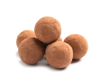 Delicious raw chocolate truffles on white background