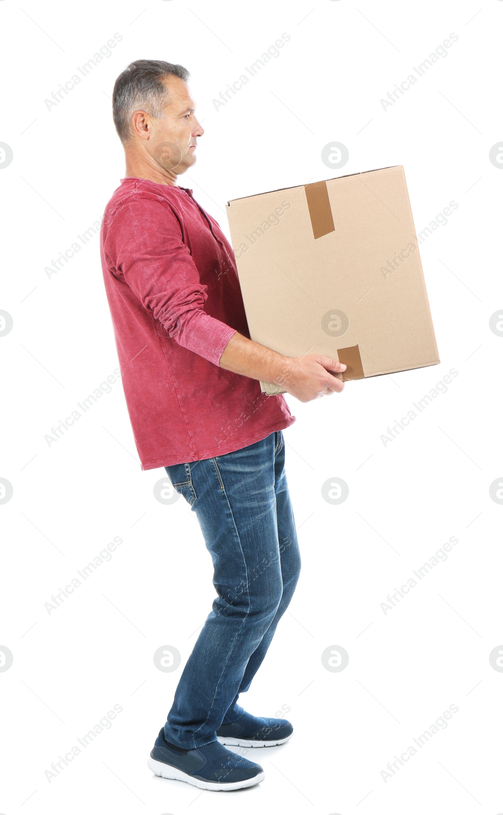 Photo of Full length portrait of mature man carrying carton box on white background. Posture concept