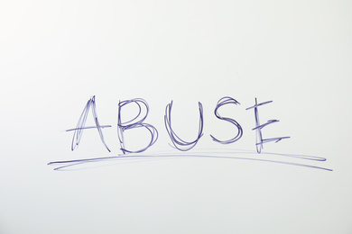 Word ABUSE on white background. Domestic violence awareness