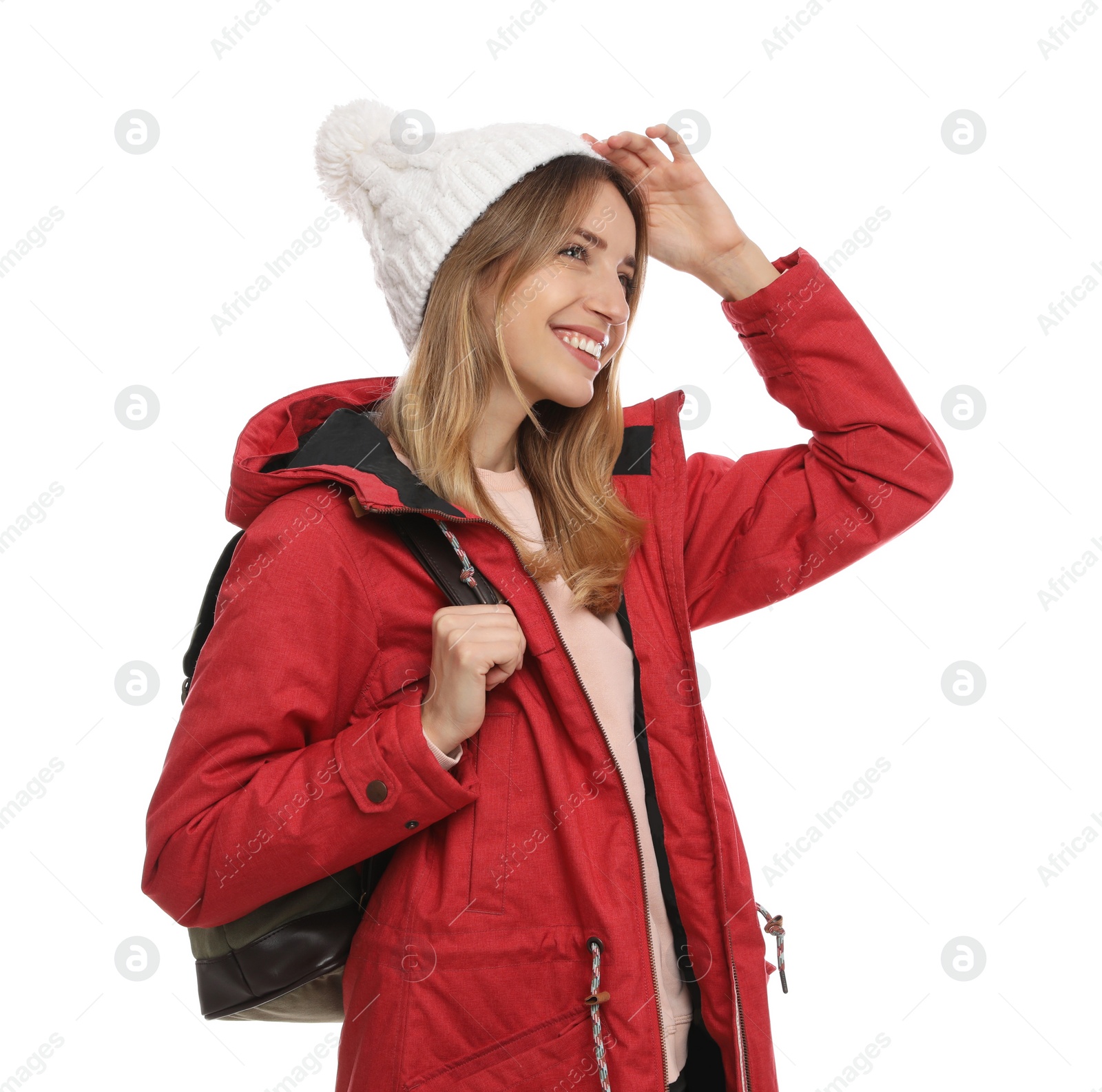 Photo of Happy woman with backpack on white background. Winter travel