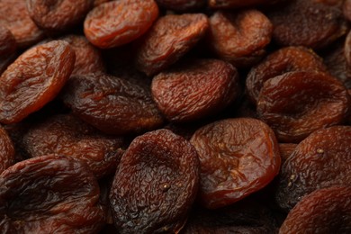 Photo of Tasty dried apricots as background, closeup. Healthy snack