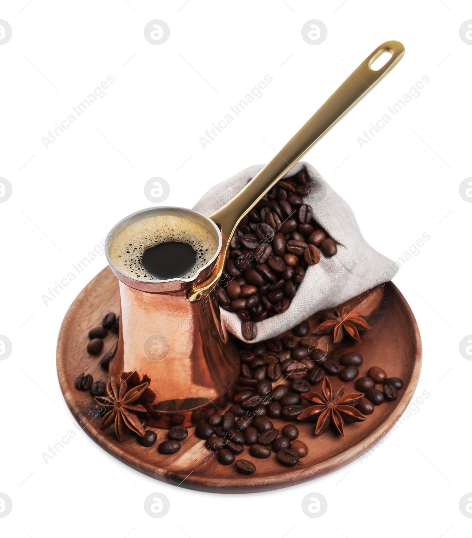 Photo of Copper turkish coffee pot with hot drink, anise stars and beans on white background