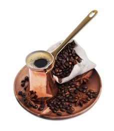 Photo of Copper turkish coffee pot with hot drink, anise stars and beans on white background