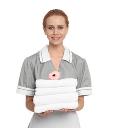 Photo of Portrait of chambermaid with towels and flower on white background