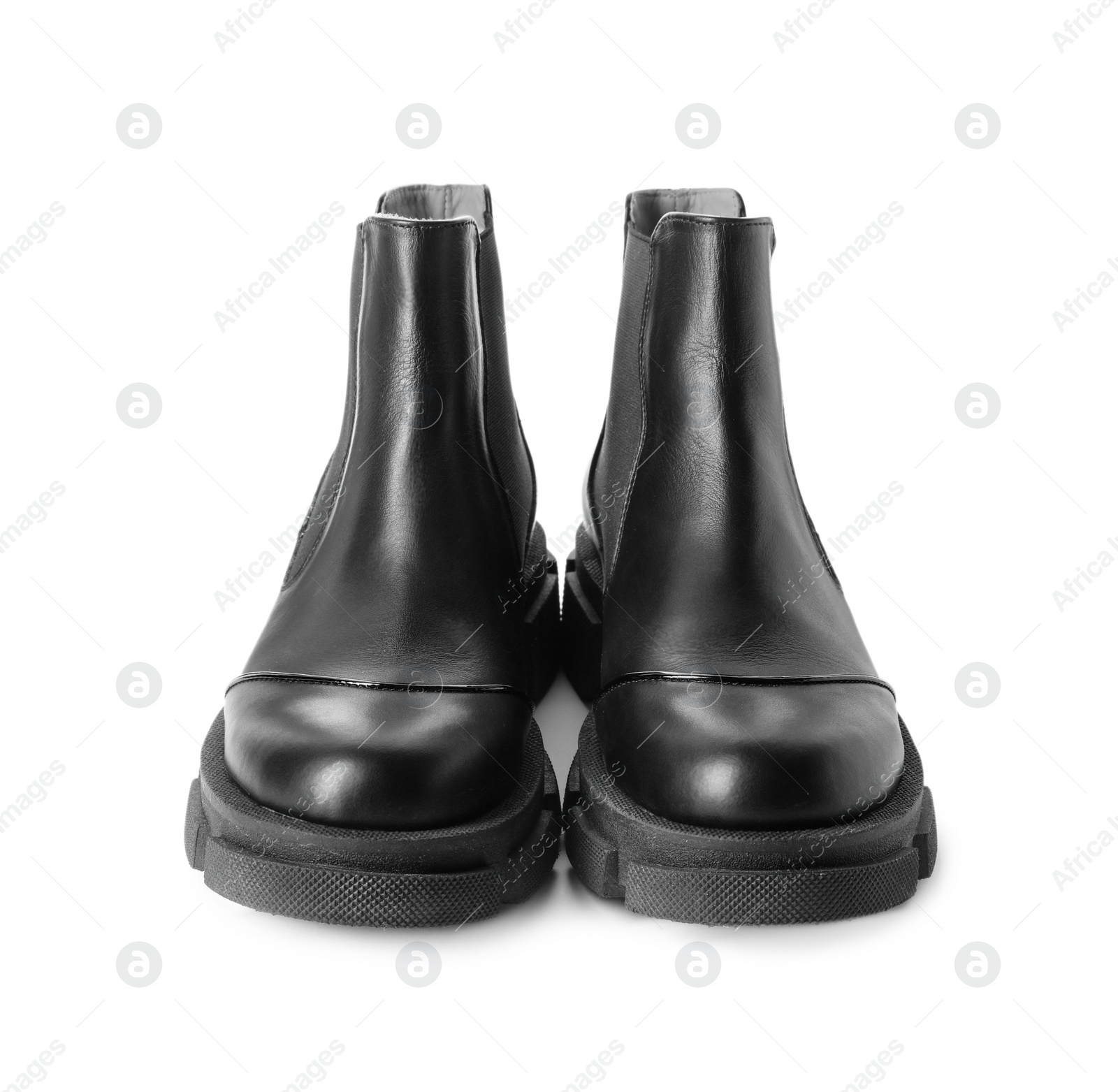 Photo of Pair of stylish boots on white background