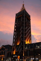 BATUMI, GEORGIA - MAY 31, 2022: Beautiful Piazza Boutique Hotel against colorful twilight sky