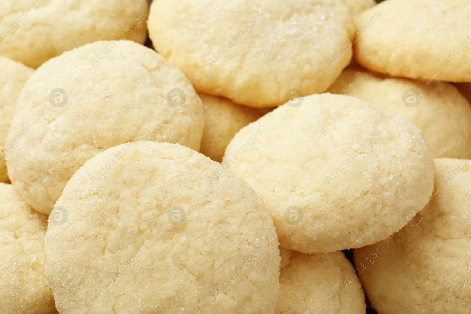 Photo of Tasty sugar cookies as background, closeup view