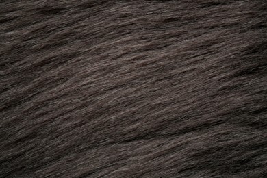 Photo of Beautiful dark faux fur as background, top view