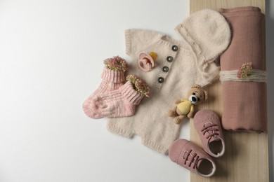 Photo of Baby clothes, shoes and accessories on light background, flat lay. Space for text