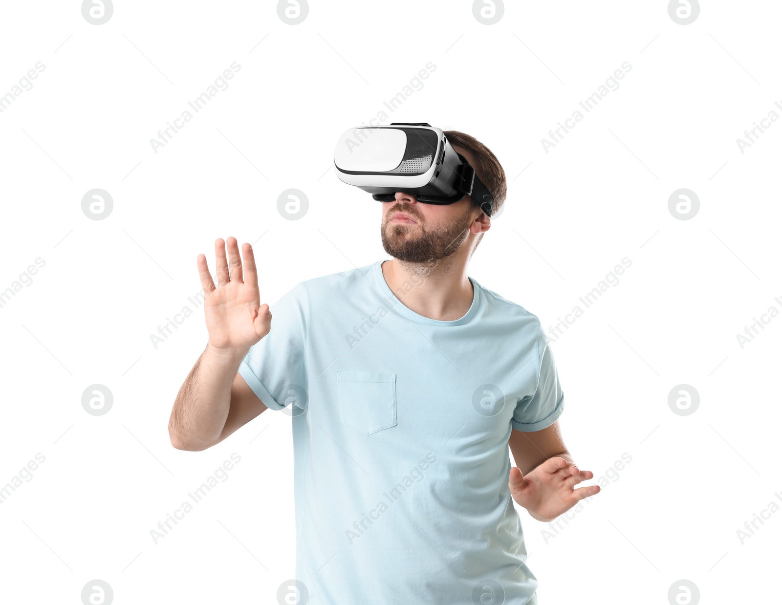 Photo of Man using virtual reality headset on white background