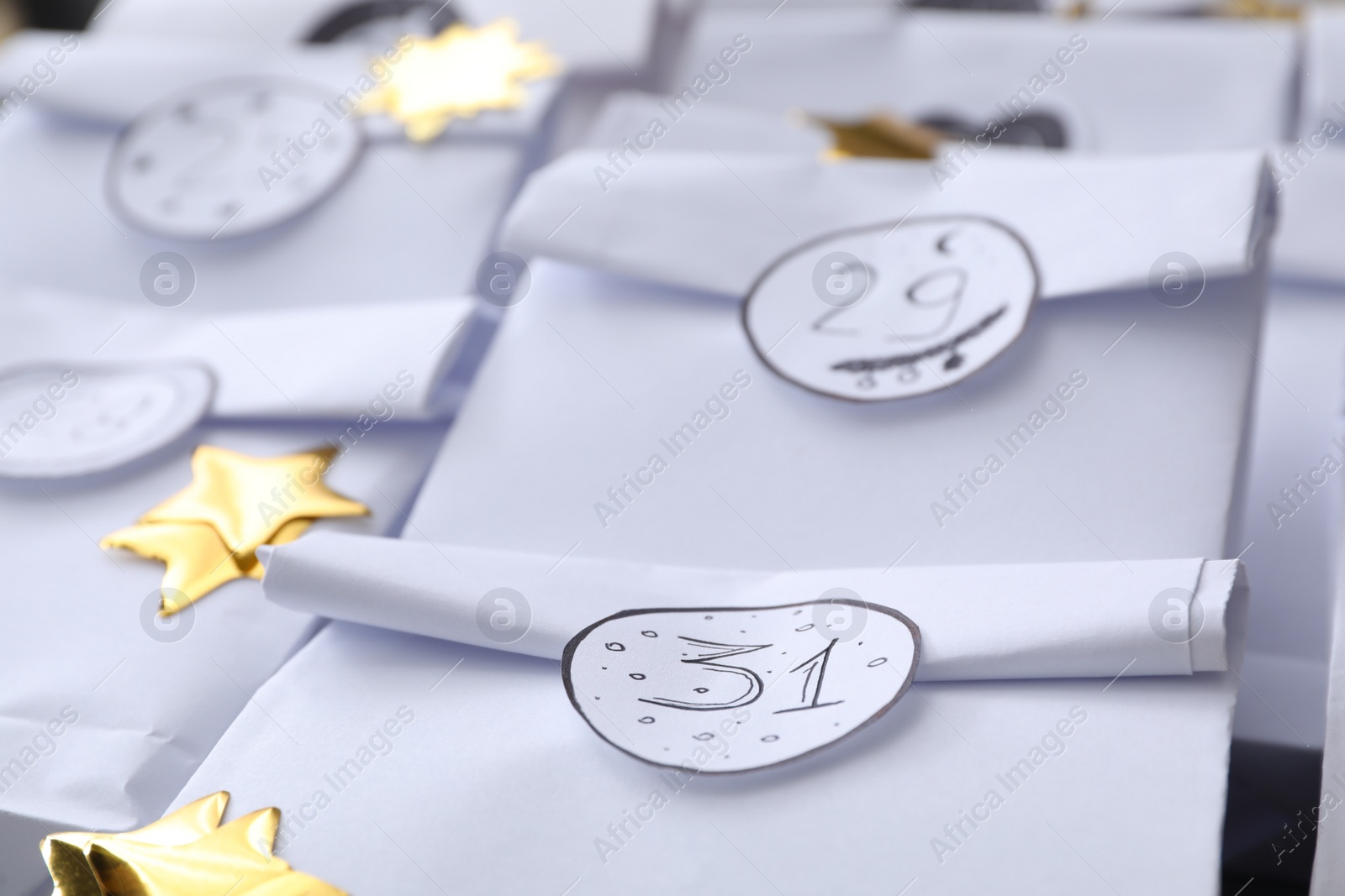 Photo of Christmas advent calendar with gifts, closeup view