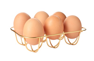 Photo of Golden metal egg tray on white background