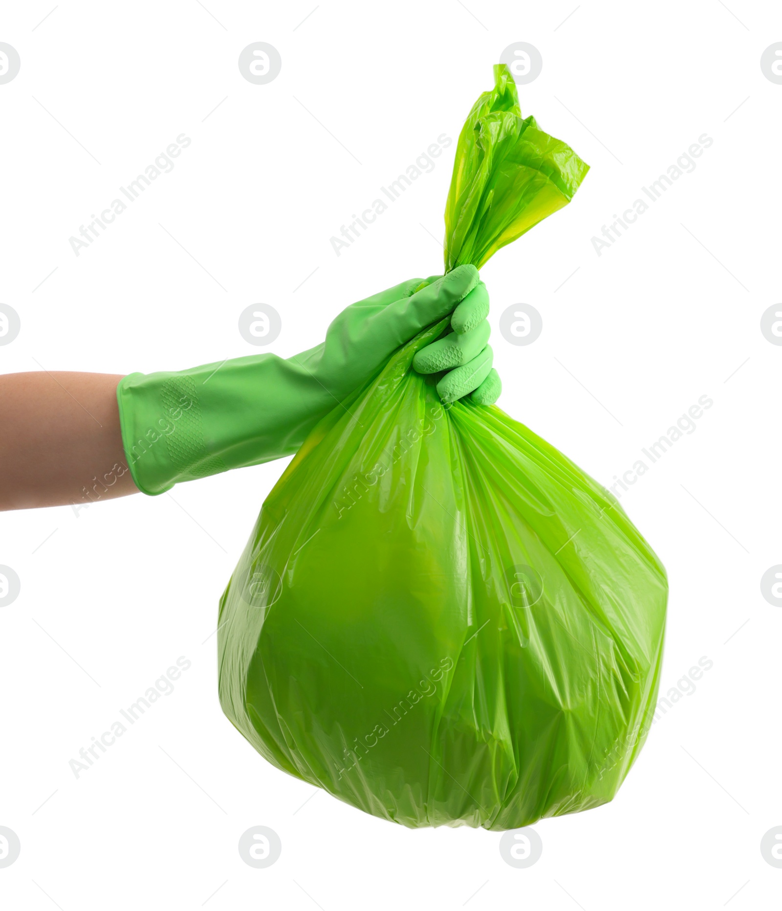 Photo of Woman holding plastic bag full of garbage on white background, closeup